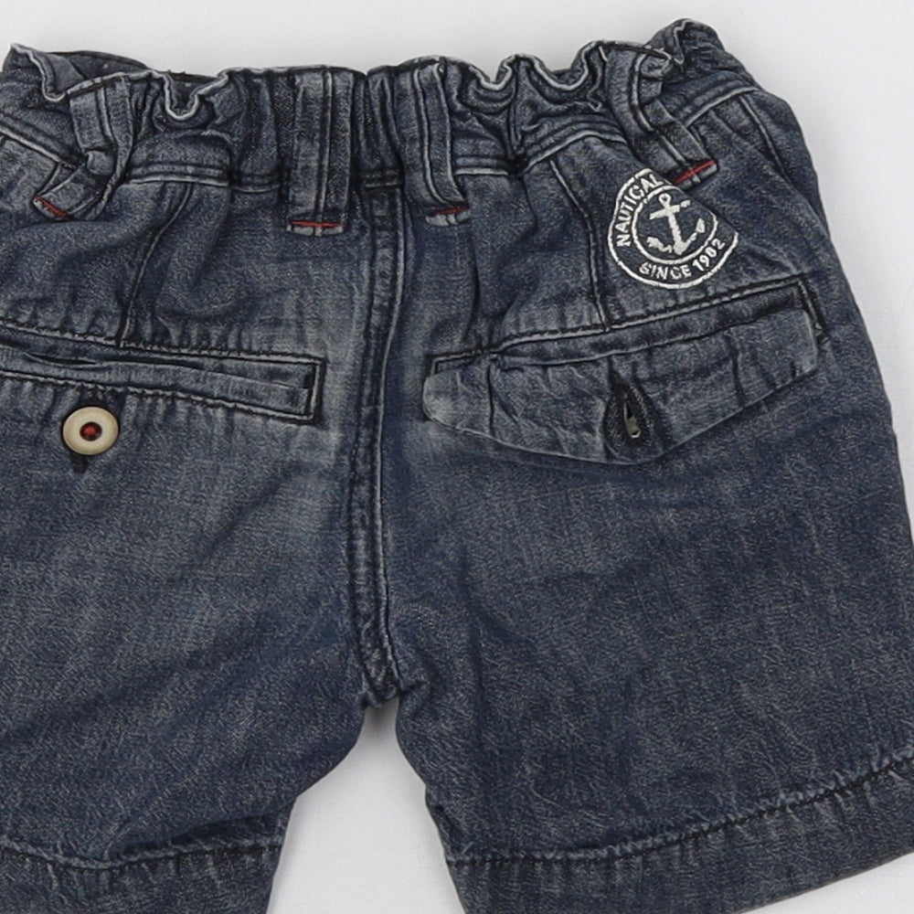 Brand and care label for Next boys’ blue cargo shorts, size 3, years