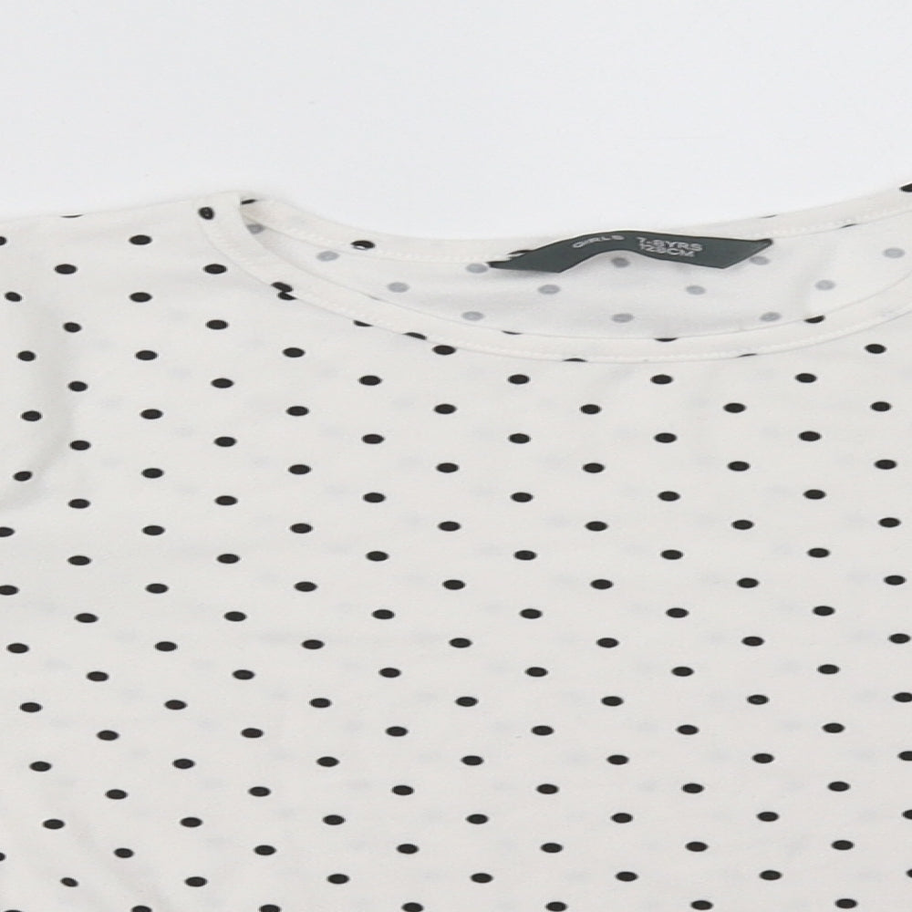 Close-up detail of Primark girls’ white polka dot pullover sweatshirt, size 7-8, years