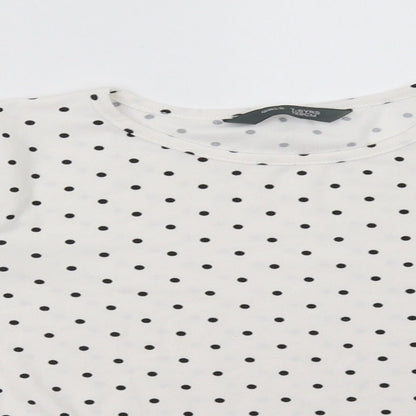 Close-up detail of Primark girls’ white polka dot pullover sweatshirt, size 7-8, years