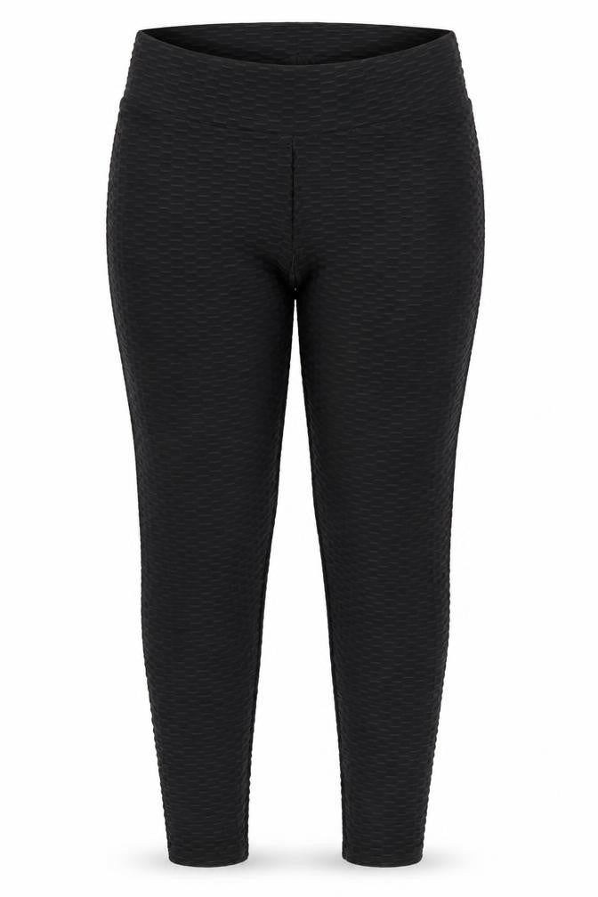 Front view of Preworn women’s black geometric jegging trousers, size L, 28-inch leg - raised weave texture ruched seat