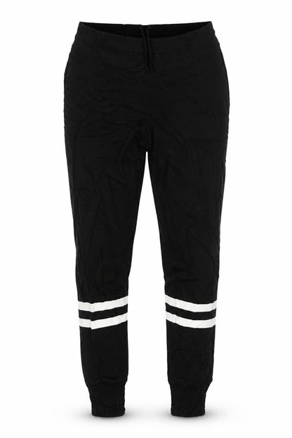 Front view of PRETTYLITTLETHING women’s black sweatpants, size M, 29-inch leg