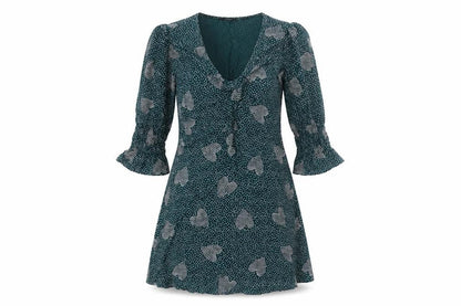 Front view of Lola Skye women’s green viscose fit & flare, size UK 8, v-neck pullover - hearts