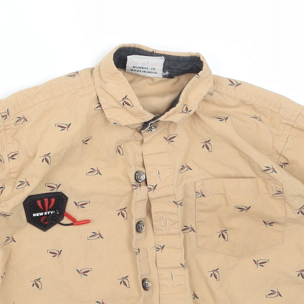 Close-up detail of TITANIC boys’ beige floral basic button-up, size 4, years collared