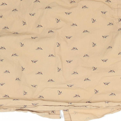 Brand and care label for TITANIC boys’ beige floral basic button-up, size 4, years collared