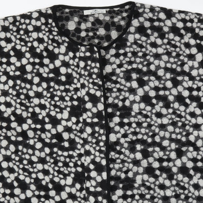 Close-up detail of LADY DISTRICT women’s multicoloured polka dot poncho, size UK 18
