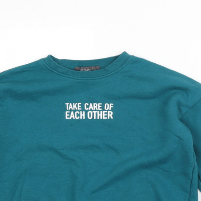 Close-up detail of Primark women’s green polyester pullover sweatshirt, size XS