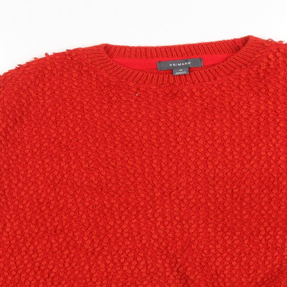 Close-up detail of Primark women’s red acrylic pullover sweatshirt, size M