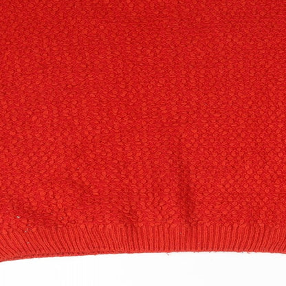 Brand and care label for Primark women’s red acrylic pullover sweatshirt, size M