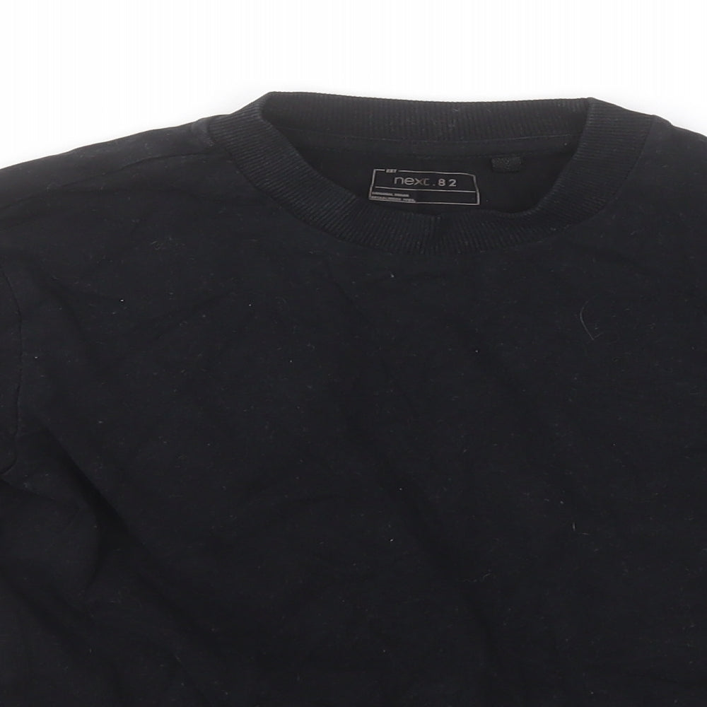 Close-up detail of Next boys’ black round neck cotton jumper, size 8, years