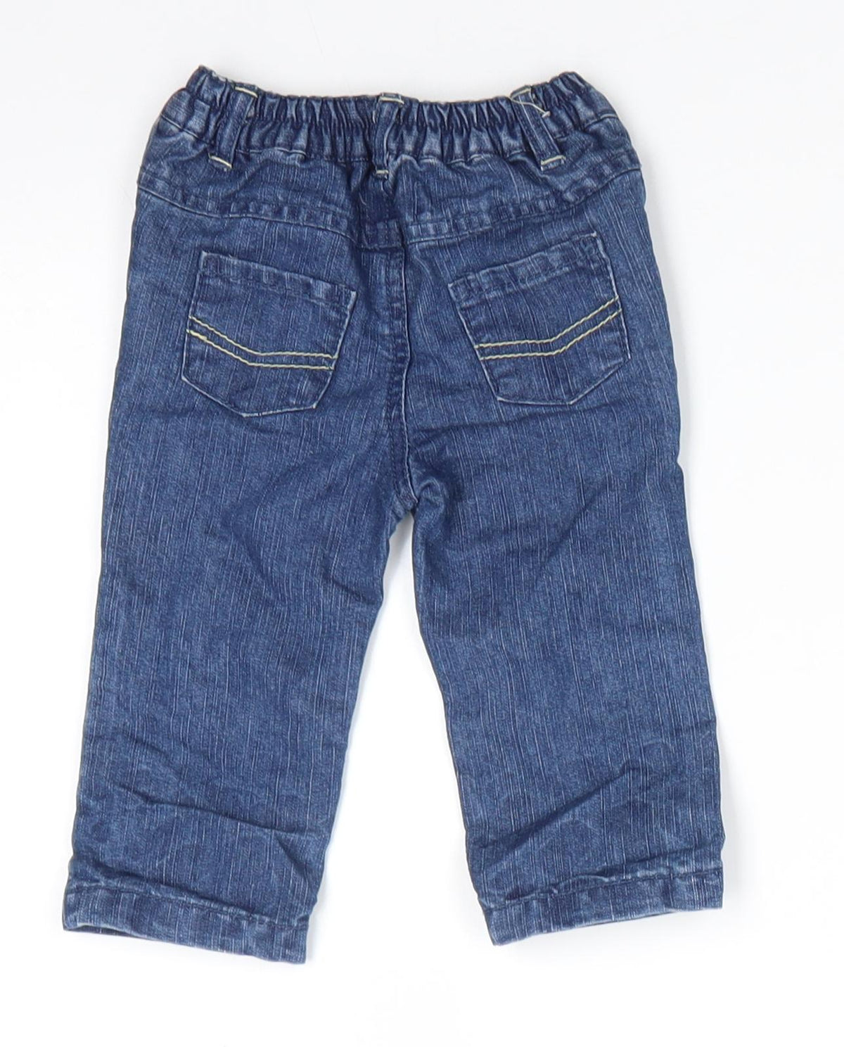 Back view of Early Days boys’ blue cotton jeans, size 3-6, months button - back elastication