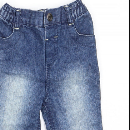 Close-up detail of Early Days boys’ blue cotton jeans, size 3-6, months button - back elastication