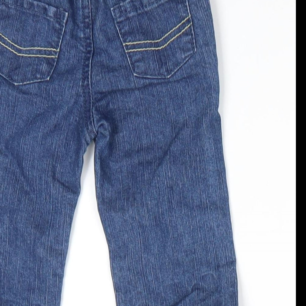 Brand and care label for Early Days boys’ blue cotton jeans, size 3-6, months button - back elastication