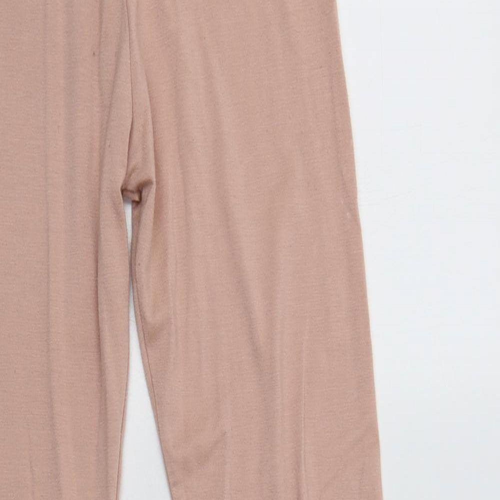 Close-up detail of Missguided women’s pink polyester lounge pants, size UK 4
