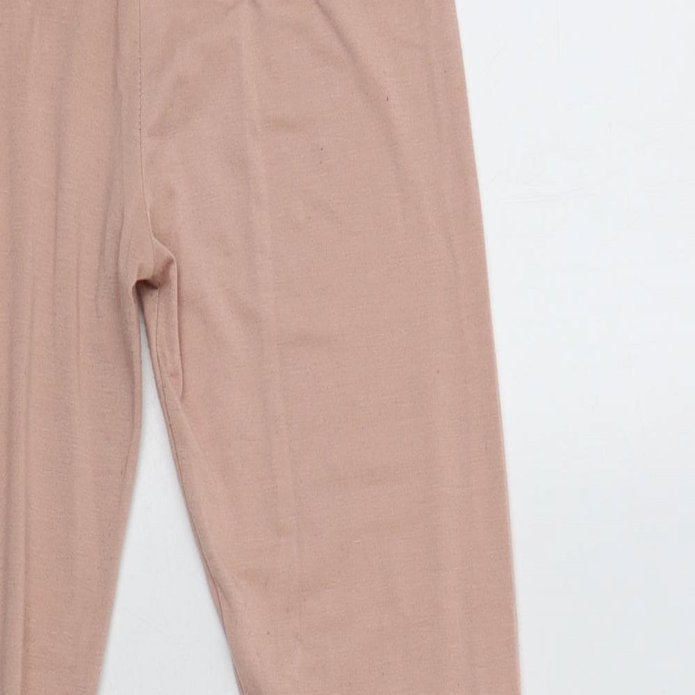 Brand and care label for Missguided women’s pink polyester lounge pants, size UK 4