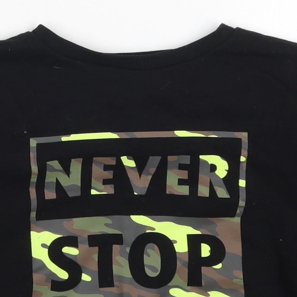 Close-up detail of Primark boys’ black cotton pullover sweatshirt, size 5-6, years pullover - never stop