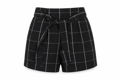 Front view of Pull&Bear women’s multicoloured check vinyl cut-off shorts, size UK 26, 6-inch leg regular