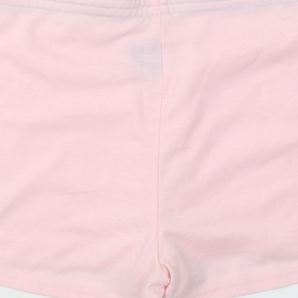 Brand and care label for Xe women’s pink polyester sweat shorts, size S, regular