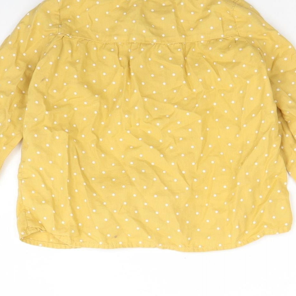 Brand and care label for H&M girls’ yellow polka dot cotton basic button-up, size 2, years round neck button