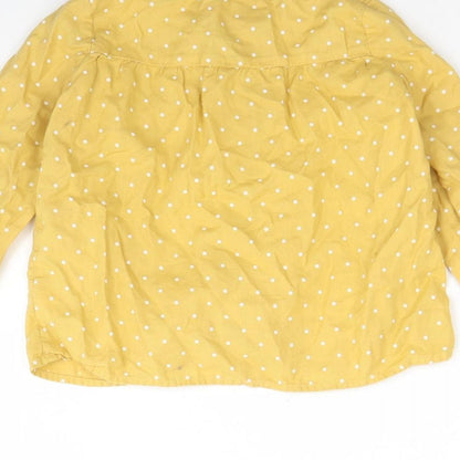 Brand and care label for H&M girls’ yellow polka dot cotton basic button-up, size 2, years round neck button