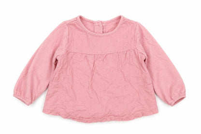 Front view of Matalan girls’ pink polka dot cotton basic t-shirt, size 3-6, months crew neck button