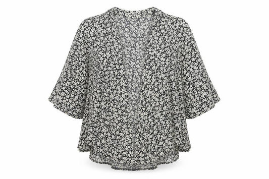 Front view of internationale women’s black floral viscose basic blouse, size UK 10, v-neck