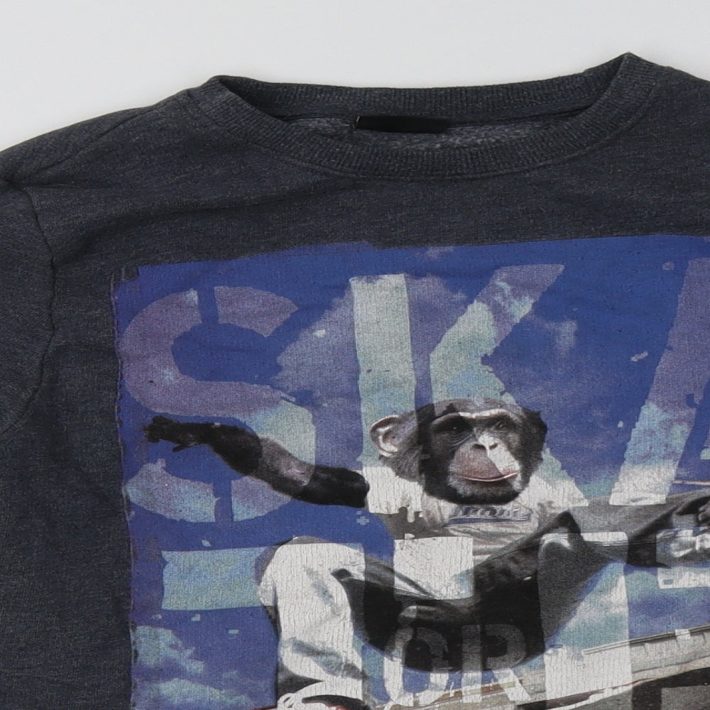 Close-up detail of Next girls’ blue cotton pullover sweatshirt, size 13, years pullover - monkey