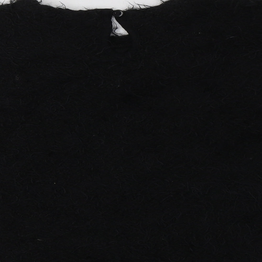 Brand and care label for George girls’ black crew neck polyester jumper, size 6-7, years button