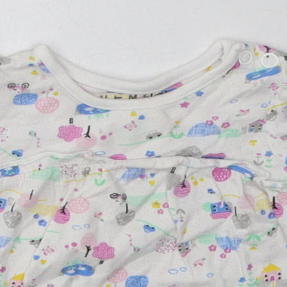 Close-up detail of Nutmeg girls’ multicoloured geometric cotton basic casual, size 3-6, months crew neck button