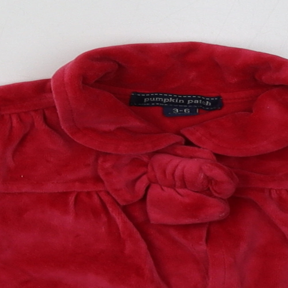 Close-up detail of Pumpkin Patch girls’ red basic jacket jacket, size 3-6, months buckle
