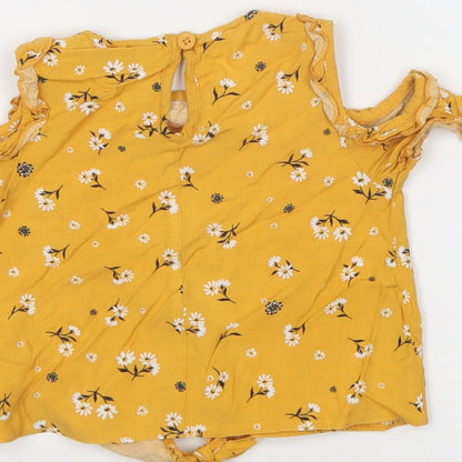 Brand and care label for Primark girls’ yellow floral viscose basic blouse, size 2-3, years crew neck button