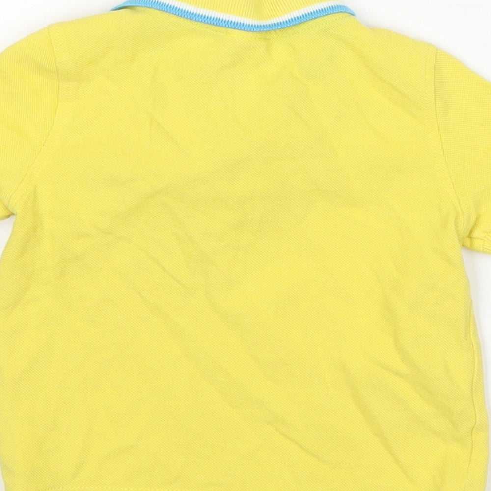 Brand and care label for Mini Club boys’ yellow cotton basic polo, size 12-18, months collared