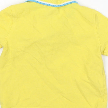 Brand and care label for Mini Club boys’ yellow cotton basic polo, size 12-18, months collared