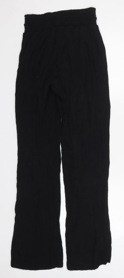 Back view of Amiani women’s black polyester trousers, size UK 25, in, 29-inch leg regular drawstring