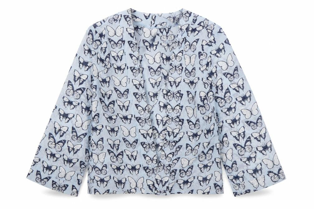 Front view of Evie girls’ multicoloured animal print polyester wrap blouse, size 5, years v-neck