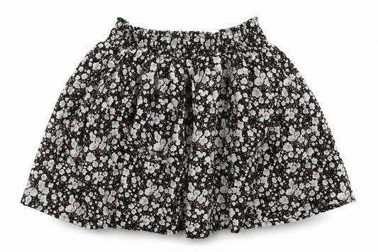 Front view of Next girls’ black floral polyester flare skirt, size 4, years regular