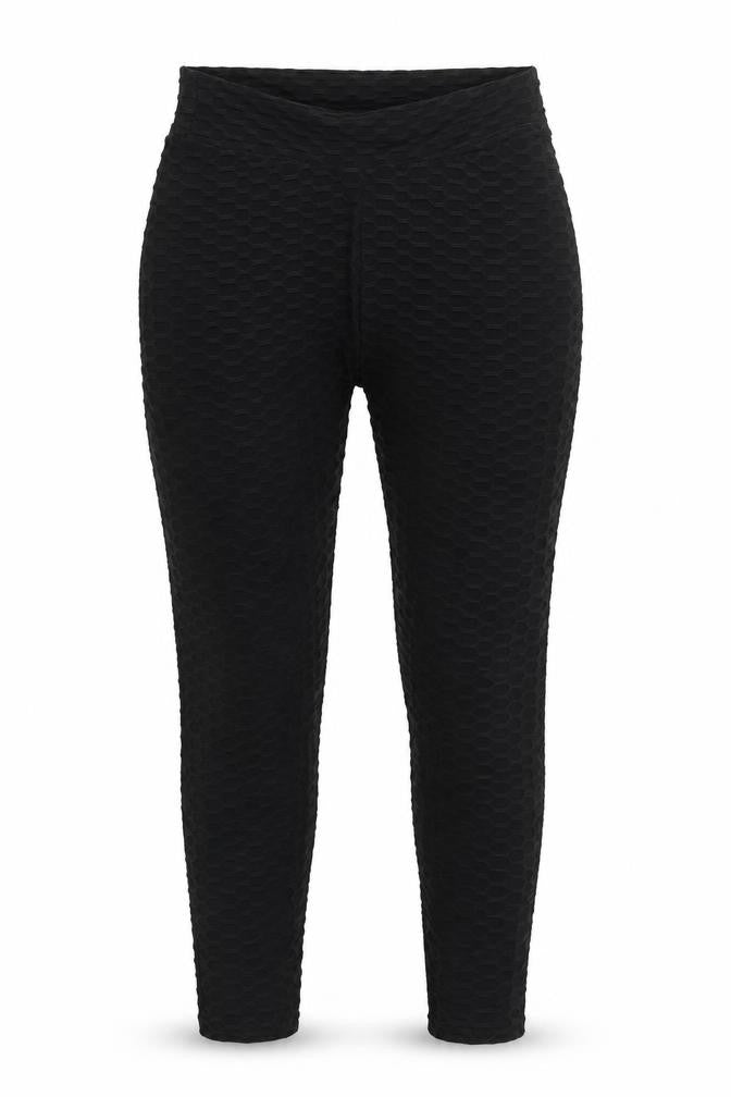 Front view of Preworn women’s black nylon carrot leggings, size L, 29-inch leg