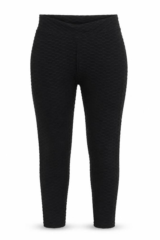 Front view of Preworn women’s black nylon carrot leggings, size L, 29-inch leg