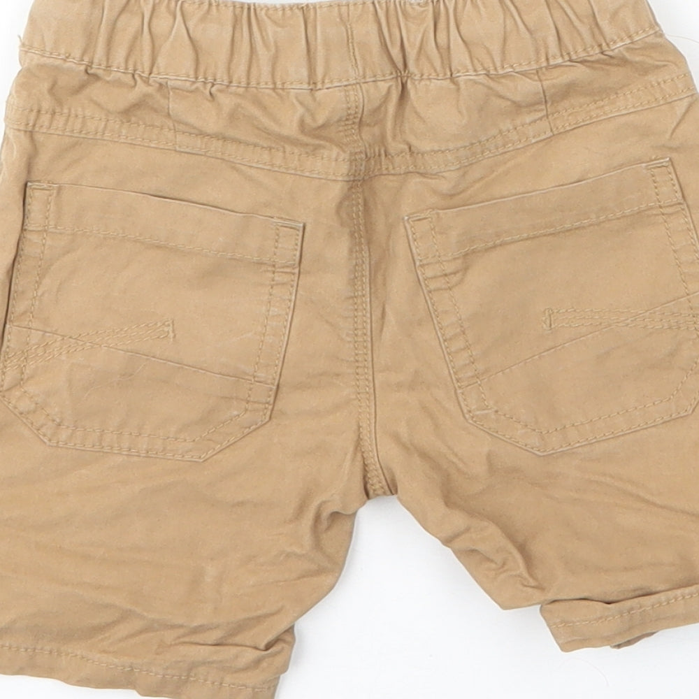 Brand and care label for Next boys’ beige cotton capri trousers, size 12, months drawstring