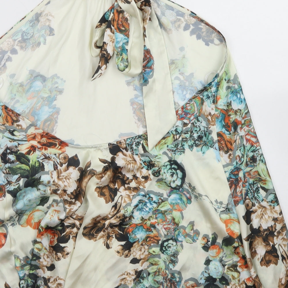 Brand and care label for Layers women’s ivory floral polyester basic blouse, size M, halter