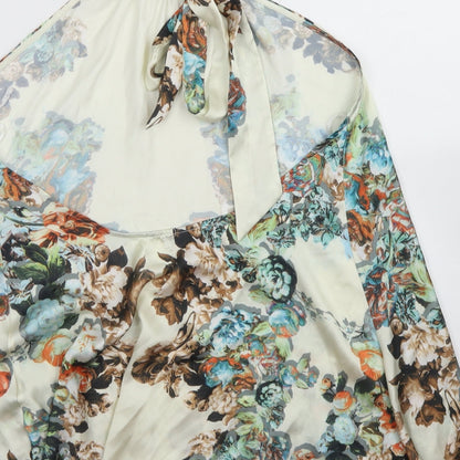 Brand and care label for Layers women’s ivory floral polyester basic blouse, size M, halter