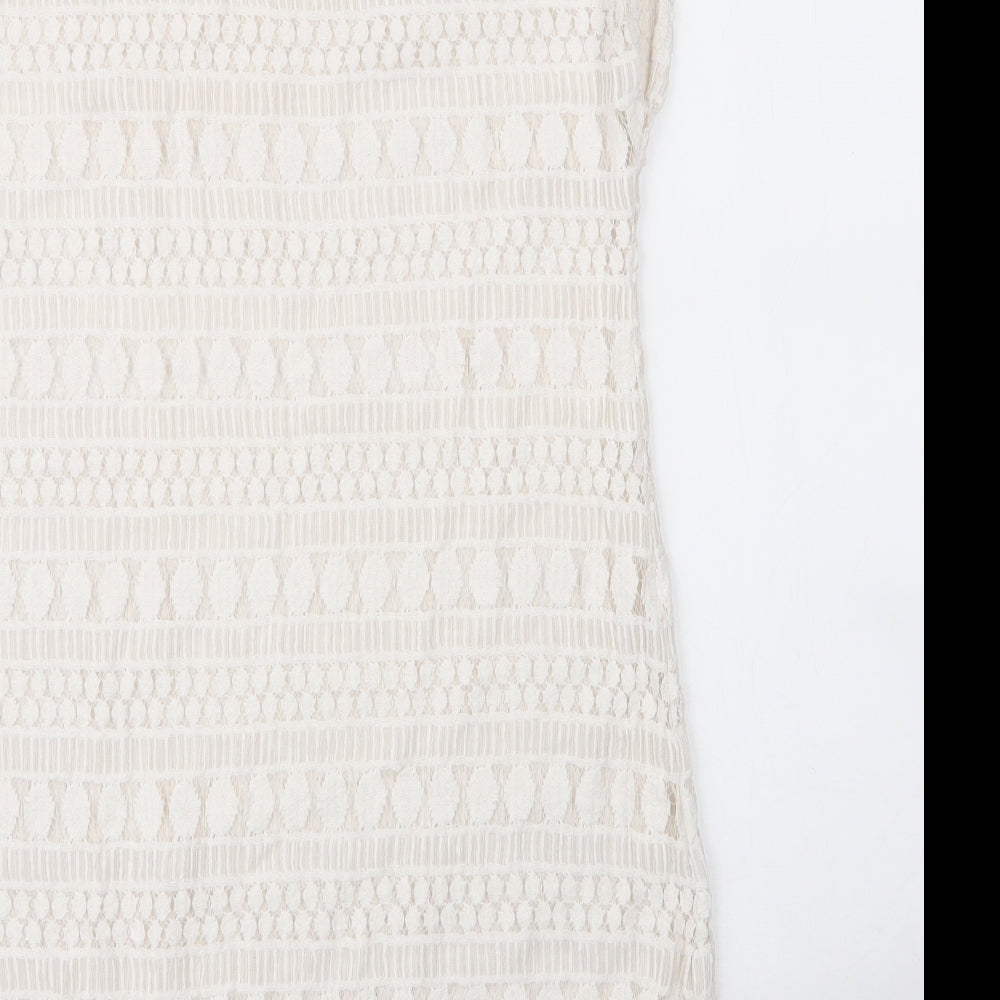 Brand and care label for Stella & Dot women’s white cotton shift, size M, round neck