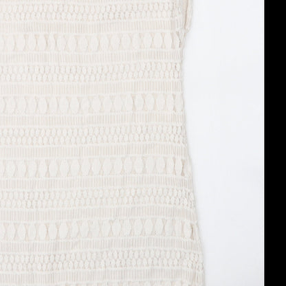 Brand and care label for Stella & Dot women’s white cotton shift, size M, round neck
