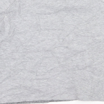 Brand and care label for Primark girls’ grey round neck polyester jumper, size 13-14, years