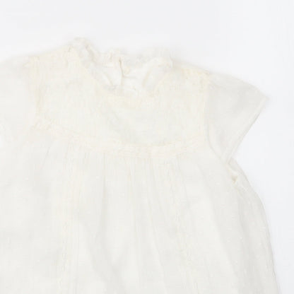 Close-up detail of George girls’ white nylon basic blouse, size 7, years round neck button
