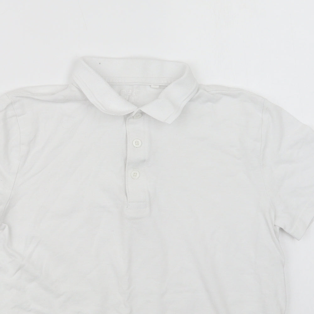 Close-up detail of Next girls’ white cotton basic polo, size 12, years collared button - school wear