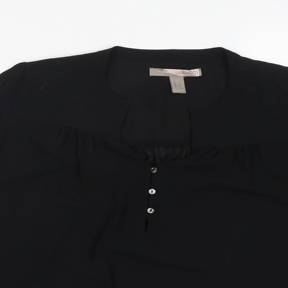 Close-up detail of Love 21 women’s black polyester basic blouse, size XS, v-neck