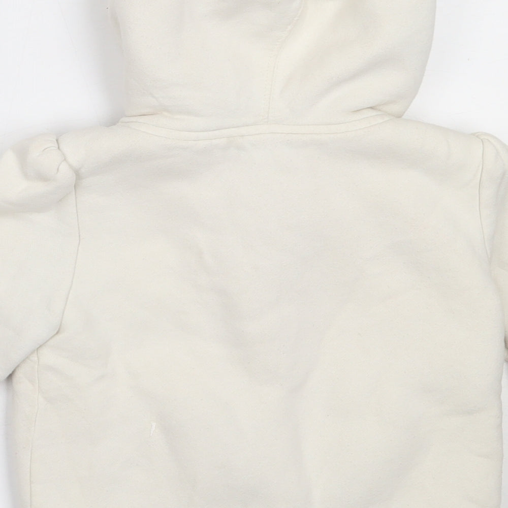 Brand and care label for Gap girls’ ivory jacket, size 5, years