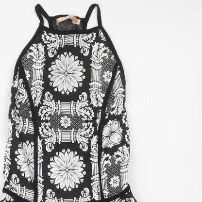 Close-up detail of Eva & Lola women’s black floral basic blouse, size S, square neck