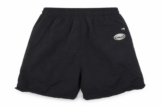 Front view of Louis Garneau women’s black nylon athletic shorts, size M, 7-inch leg regular drawstring