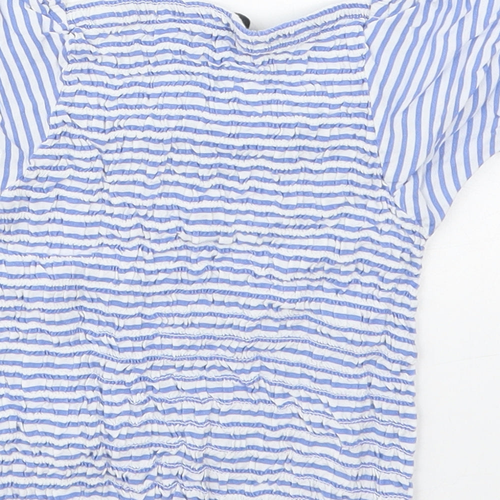 Brand and care label for Evie girls’ blue striped viscose basic blouse, size 9-10, years square neck pullover